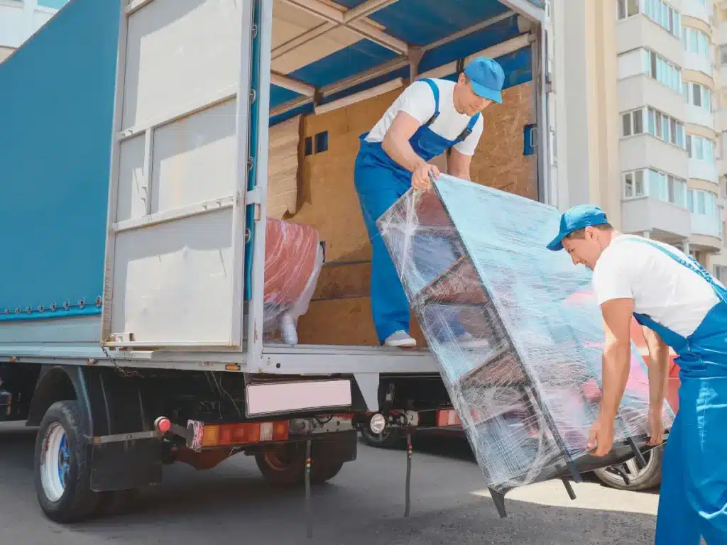 Men loading furniture in a moving truck